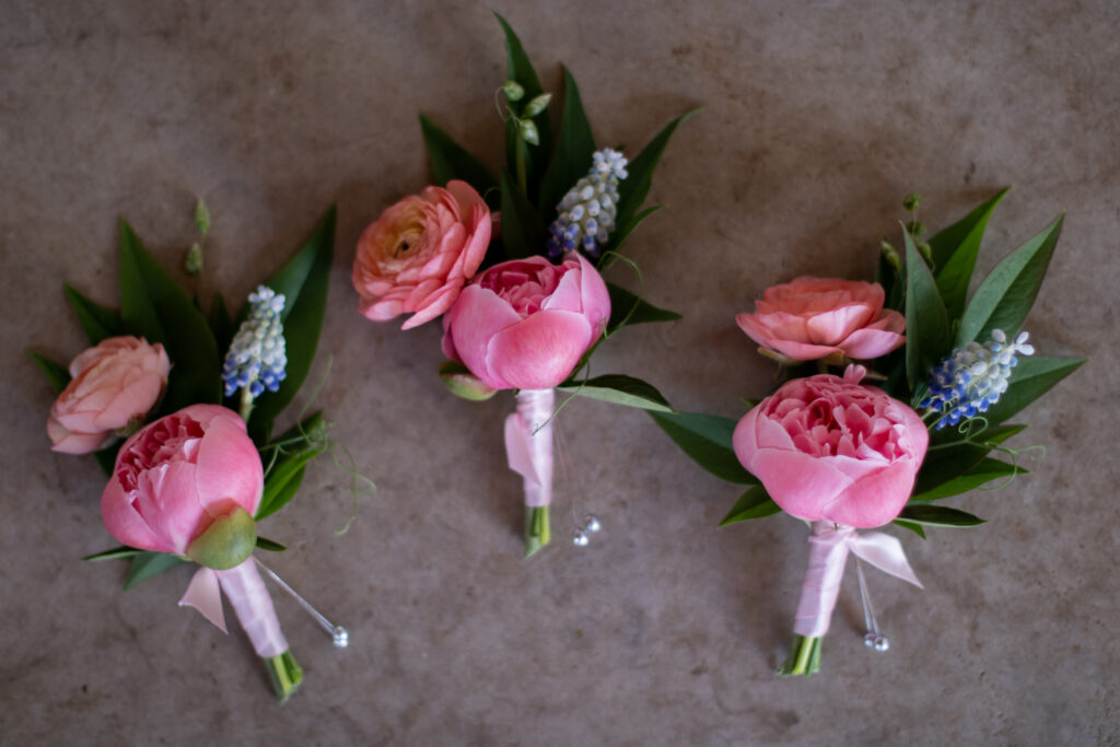 Corsages made with fresh local spring flowers including ranunculus and muscari